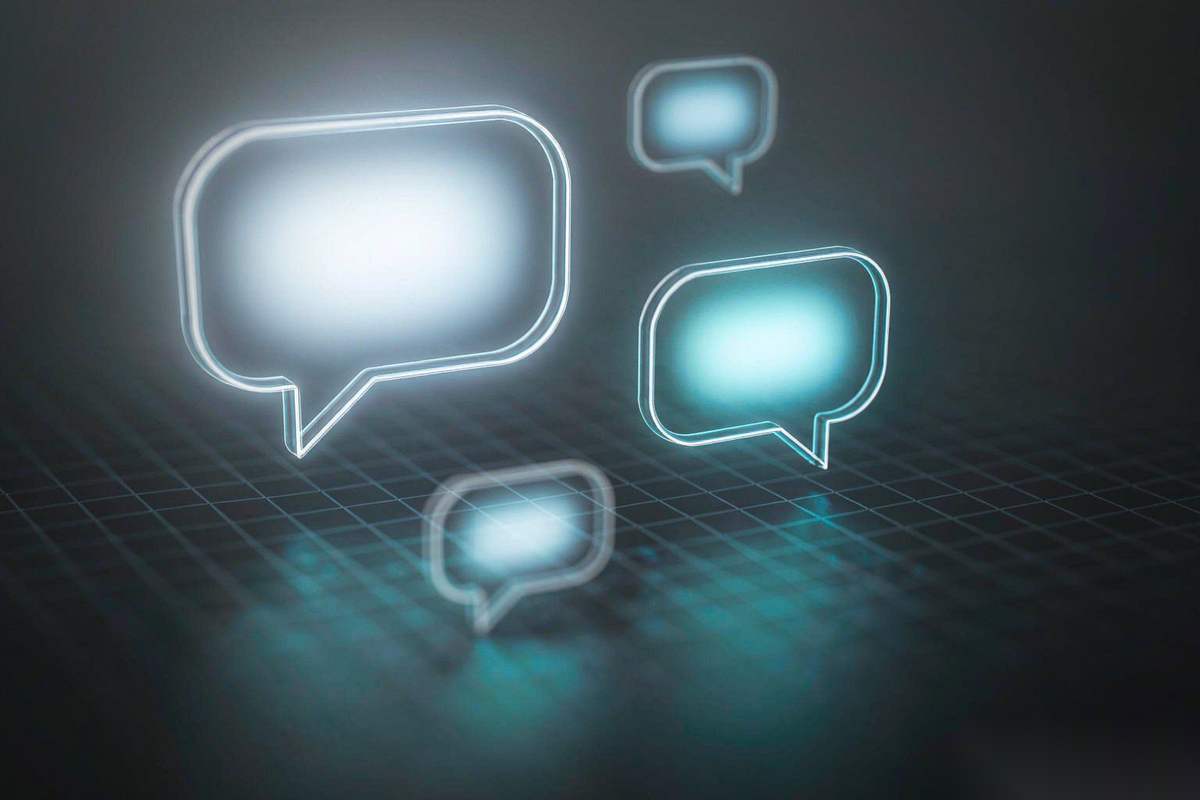 A dense grid of tiny conversation bubbles, one column of which glows softly brighter than the rest