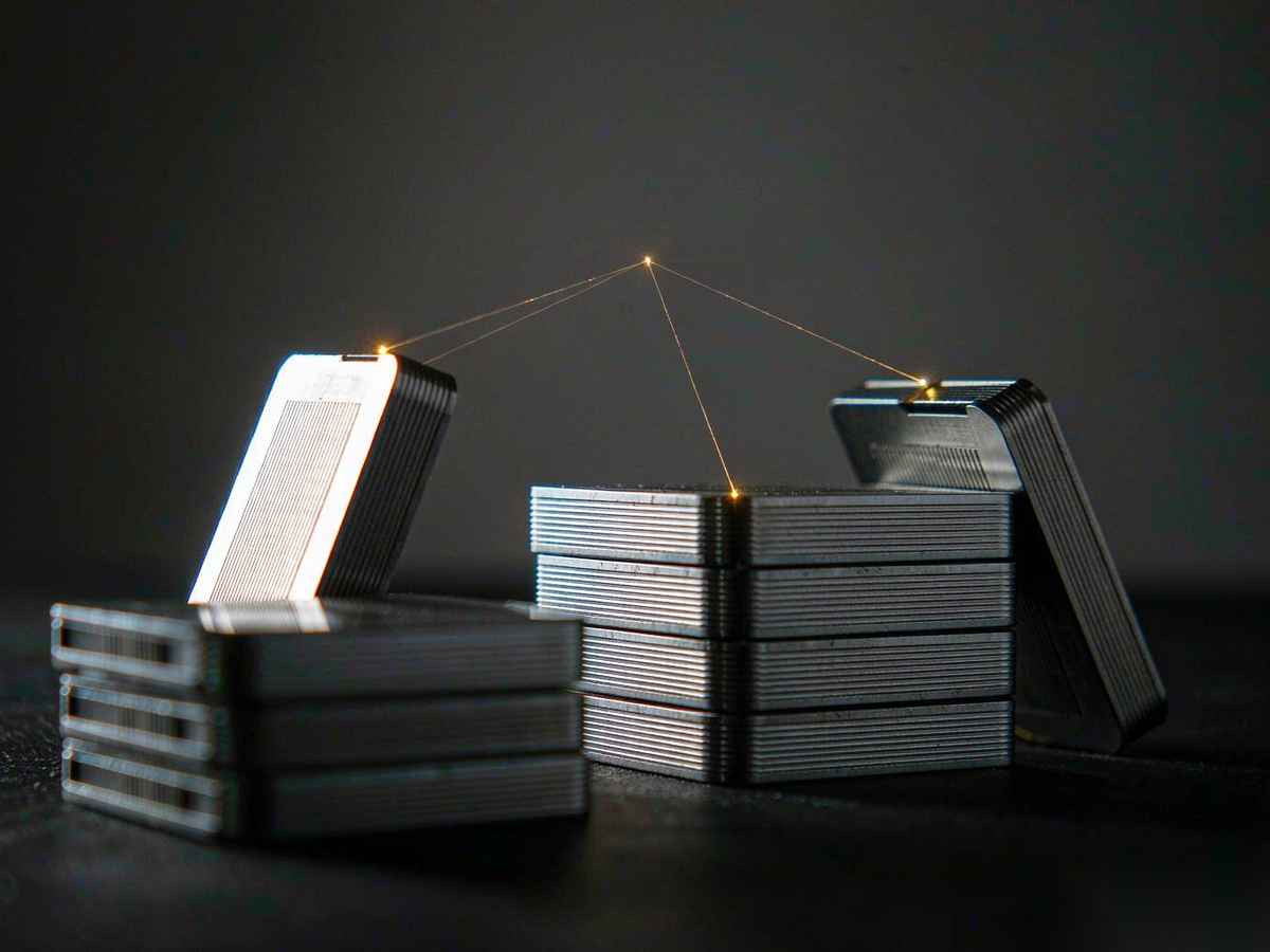 A translucent glowing folder is pulled by a beam of light from one side toward a dark workbench on the other, small data nodes along its edge, suggesting skills and memories being migrated to a new platform